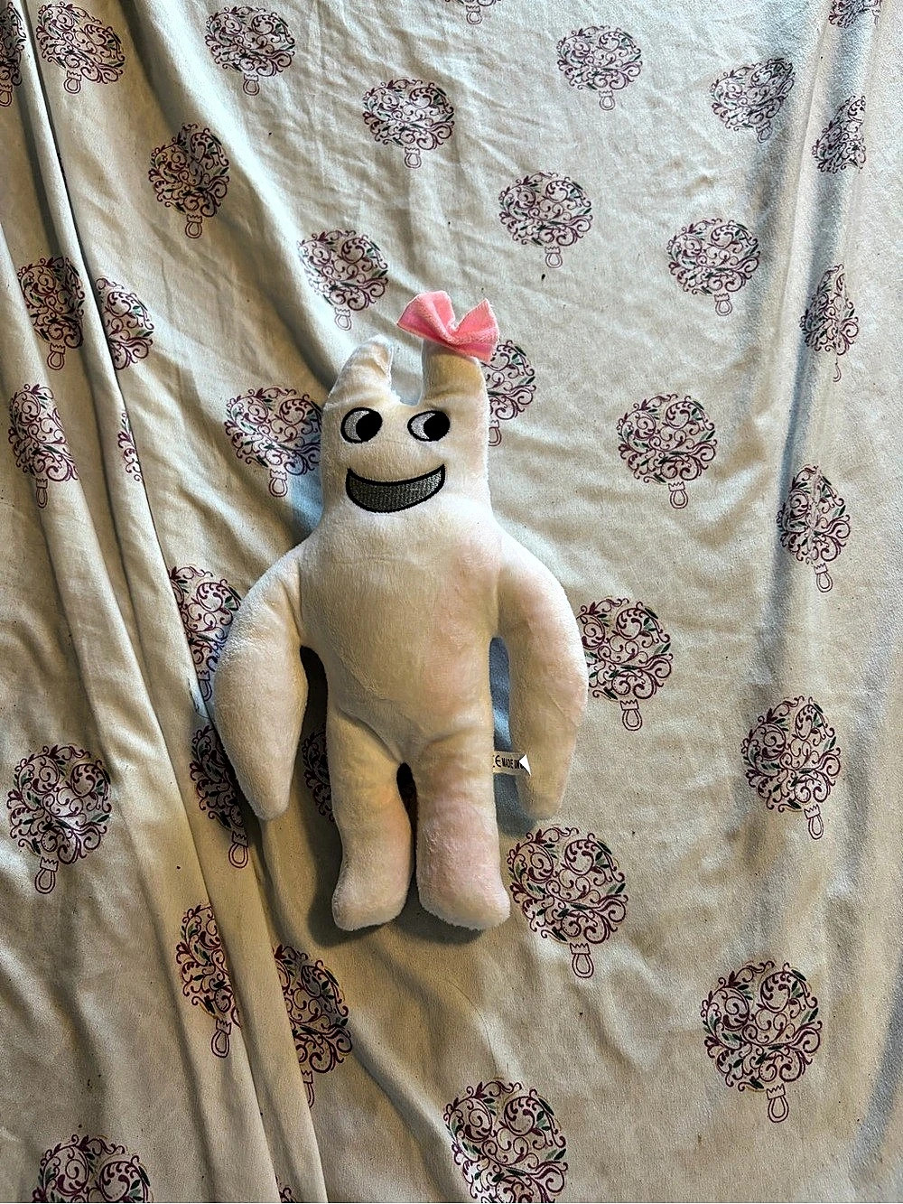White Plush Stuffed Animal with Pink Bow